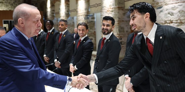 Turkish President Recep Tayyip Erdogan meets with the Gulta Saray football team