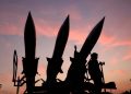 Iran's agreement to purchase hundreds of air defense missiles from China.