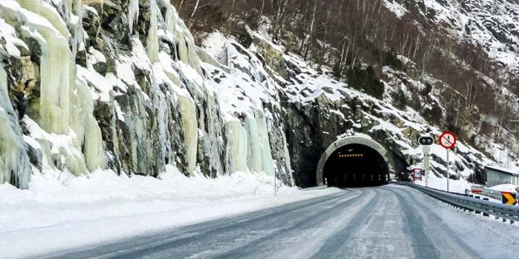 Building a tunnel under the snow-capped mountains
