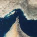 Iran maintains control over the Strait of Hormuz; threatens US with a severe military response.