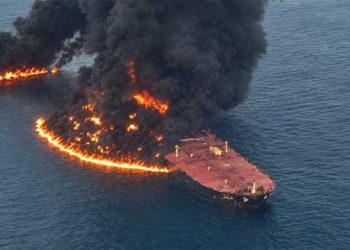 An oil supertanker caught fire after striking a mine in the Strait of Hormuz.