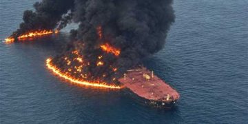 An oil supertanker caught fire after striking a mine in the Strait of Hormuz.